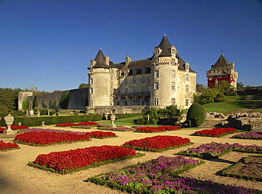 Exterior of Chateau Rochecourbon and colourful flowerbeds in formal gardens, near Saintes, Western Loire, France, Europe