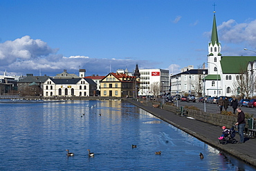 View over Tjornin (pond) to city behind, Reykjavik, Iceland, Polar Regions