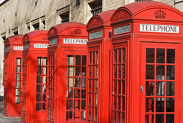 Row of old-fashioned red telephone boxes, Broad Court, near the Royal Opera House, Covent Garden, London, England, United Kingdom, Europe