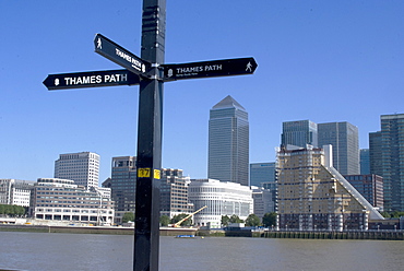 Thames path sign and view of Canary Wharf from Rotherhithe, London, England, United Kingdom, Europe