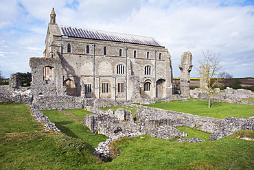 The grounds of the ruined Benedictine Priory of Binham Abbey founded in the 11th century, with the existing church behind, North Norfolk, England, United Kingdom, Europe