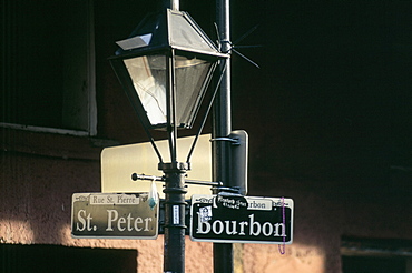 Bourbon Street sign on lamp at dusk, New Orleans, Louisiana, United States of America, North America