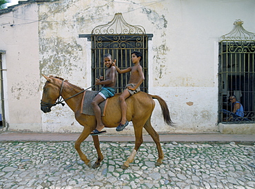 Boys riding on a horse, Trinidad, Cuba, West Indies, Central America