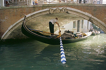 Gondola passing under a bridge, Venice, Veneto, Italy, Europe