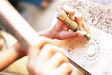 Craftsman using chisel on stone, Fez, Morocco, North Africa, Africa