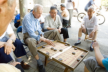 Elderly men playing a form of chess, Hu Hai Lake, Beijing, China, Asia