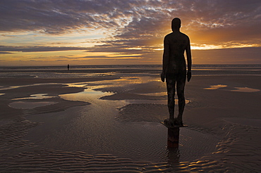 Another Place statues by artist Antony Gormley on Crosby beach, Merseyside, England, United Kingdom, Europe