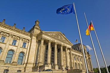 The EU and German national flags flying outside the famous Reichstag parliament building, Berlin, Germany, Europe