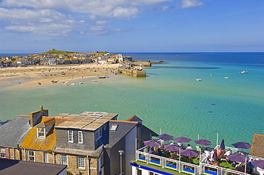 Low tide, looking over the rooftops and across the harbour at St. Ives ( Pedn Olva ) towards The Island or St. Ives head, North Cornwall, England, United Kingdom, Europe