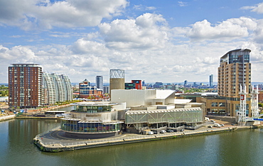 View across the Lowry Centre, apartments and new building construction work at Salford Quays Pier 8, Greater Manchester, England, United Kingdom, Europe