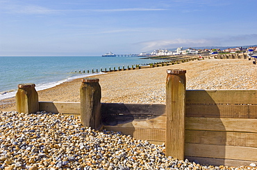 Pebble beach and groynes, Eastbourne Pier in the distance, Eastbourne, East Sussex, England, United Kingdom, Europe