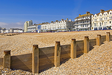 Pebble beach and groynes, hotels on the seafront promenade, Eastbourne, East Sussex, England, United Kingdom, Europe