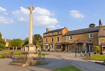 War Memorial stone cross on the High Street in the village of Broadway, The Cotswolds, Worcestershire, England, United Kingdom, Europe