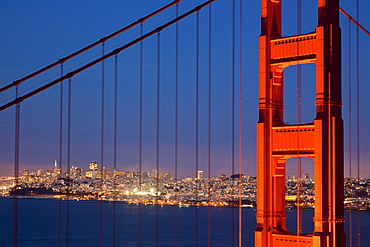 The Golden Gate Bridge, linking the city of San Francisco with Marin County, taken from the Marin Headlands at night with the city in the background, Marin County, California, United States of America, North America