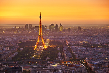 Paris skyline at sunset with the Eiffel Tower and La Defense, Paris, France, Europe