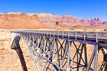 Lone tourist on Old Navajo Bridge over Marble Canyon and Colorado River, near Lees Ferry, Arizona, United States of America, North America 