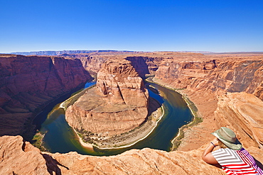 Tourist overlooking Horseshoe Bend on the Colorado River, Page, Arizona, United States of America, North America 