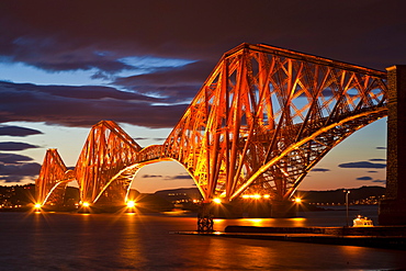 Forth Rail Bridge over the River Forth illuminated at night, South Queensferry, Edinburgh, Midlothian, Scotland, United Kingdom, Europe