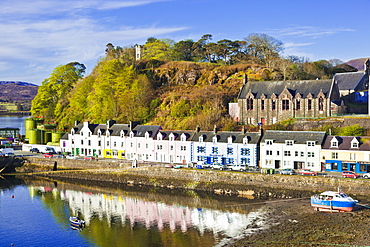 Multi-coloured houses with reflections in Portree harbour, Isle of Skye, Inner Hebrides, Highlands and Islands, Scotland, United Kingdom, Europe