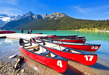 Red canoes for hire on Lake Louise, Banff National Park, UNESCO World Heritage Site, Alberta, The Rockies, Canada, North America