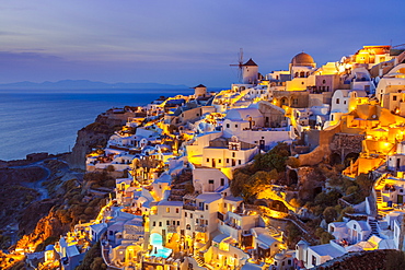 Windmill and traditional houses after sunset, Oia, Santorini (Thira), Cyclades Islands, Greek Islands, Greece, Europe