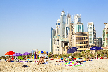 Sunbathers on the Public Dubai Beach at JBR (Jumeirah Beach Resort), Dubai, United Arab Emirates, Middle East