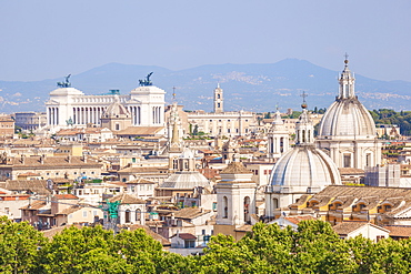 Churches and domes of the Rome skyline showing Victor Emmanuel II monument in the distance, Rome, Lazio, Italy, Europe