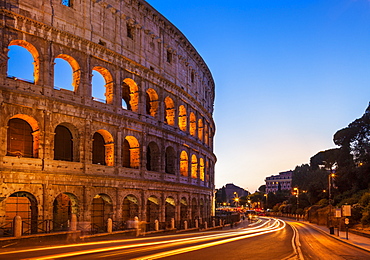 Rome Colosseum (Flavian Amphitheatre) at night with light trail, UNESCO World Heritage Site, Rome, Lazio, Italy, Europe