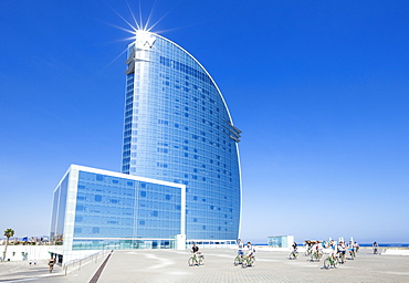 Cyclists outside the Hotel W at Barceloneta, Barcelona, Catalonia (Catalunya), Spain, Europe