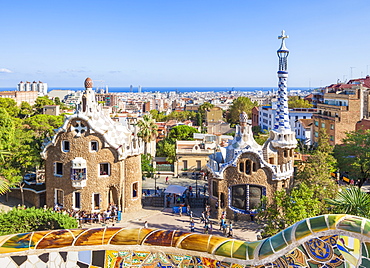 Entrance lodge to Parc Guell designed by Antoni Gaudi, UNESCO World Heritage Site, with a skyline view of the city of Barcelona, Catalonia (Catalunya), Spain, Europe