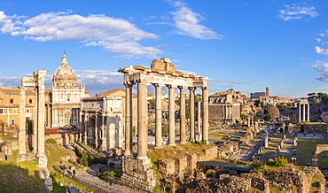 The columns of the Temple of Saturn and overview of the ruined Roman Forum, UNESCO World Heritage Site, Rome, Lazio, Italy, Europe