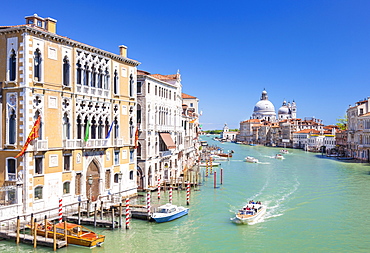 Vaporettos passing Palazzo Cavalli-Franchetti and the Santa Maria della Salute on the Grand Canal, Venice, UNESCO World Heritage Site, Veneto, Italy, Europe