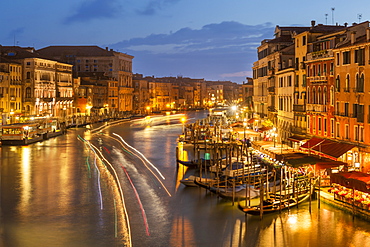 Grand Canal at night with boat light trails and moored gondolas, on the Fondementa del Vin, UNESCO World Heritage Site, Venice, Veneto, Italy, Europe