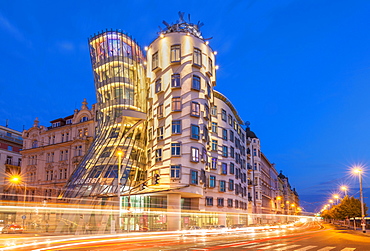 Dancing House (Ginger and Fred) at night by Frank Gehry, busy traffic light trails, Prague, Bohemia, Czech Republic, Europe