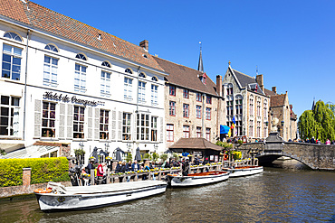 Boat tours on The Den Dijver Bruges canal in front of the Hotel De Orangerie in Bruges, Belgium, Europe