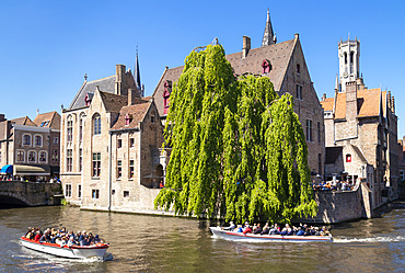 Bruges Belfry and tourist boats on Den Dijver Bruges Canal, Bruges, UNESCO World Heritage Site, West Flanders, Belgium, Europe