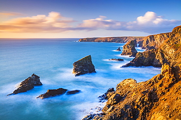 Sunset, Bedruthan steps sea stacks at high tide, Carnewas, Bedruthan, North Cornwall coast, Cornwall, England, United Kingdom, Europe