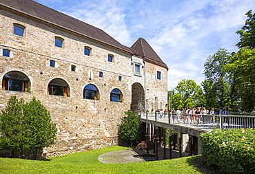 Ljubljana Castle entrance with moat and drawbridge standing on Castle Hill, Ljubljana, Slovenia, Europe