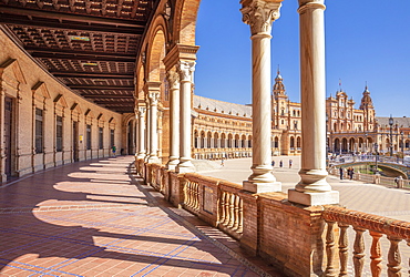 Under the arches of the semicircular Plaza de Espana, Maria Luisa Park, Seville, Andalusia, Spain, Europe