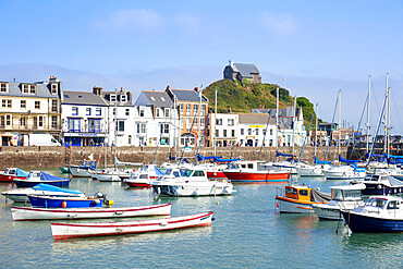 Ilfracombe harbour with yachts and St. Nicholas Chapel overlooking the town of Ilfracombe, Devon, England, United Kingdom, Europe