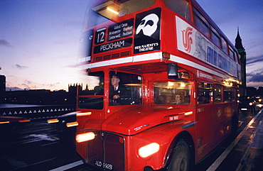 Double-decker bus going over Westminster Bridge, London