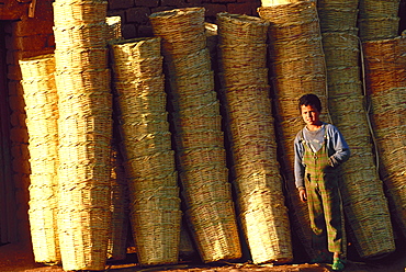 Young boy selling baskets, Ouarzazate, Morocco