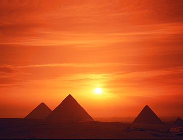 The pyramids silhouetted at dusk, Giza, Cairo, Egypt, Africa