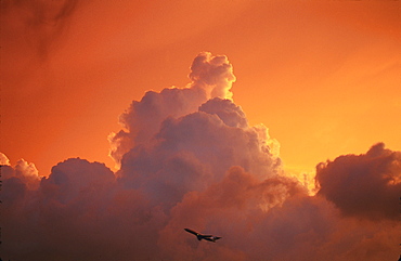 Commercial aeroplane taking off at dusk