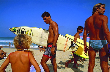 Surfers on Copacabana beach, Rio de Janeiro, Brazil