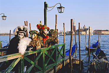 People wearing masked carnival costumes, San Giorgio in the background, Venice Carnival, Venice, Veneto, Italy