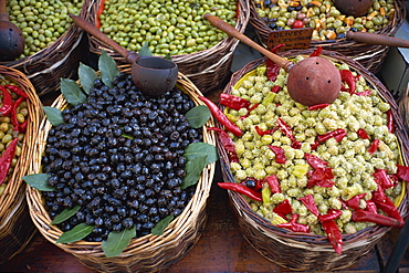 High angle view of baskets of black and green olives on a stall in the market, Provence, France, Europe