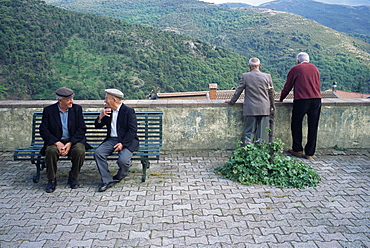 Men watching procession, Desulo (Gennargentu), Sardinia, Italy, Europe