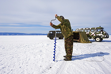 Fishing on the ice, Maloe More (Little Sea), frozen lake during winter, Olkhon island, Lake Baikal, UNESCO World Heritage Site, Irkutsk Oblast, Siberia, Russia, Eurasia 