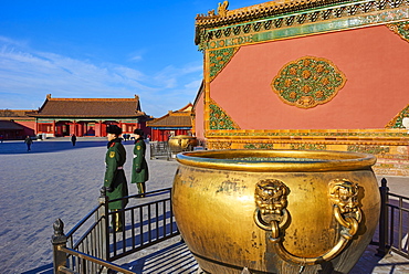 Golden cistern and security guards in the Forbidden City, Beijing, China